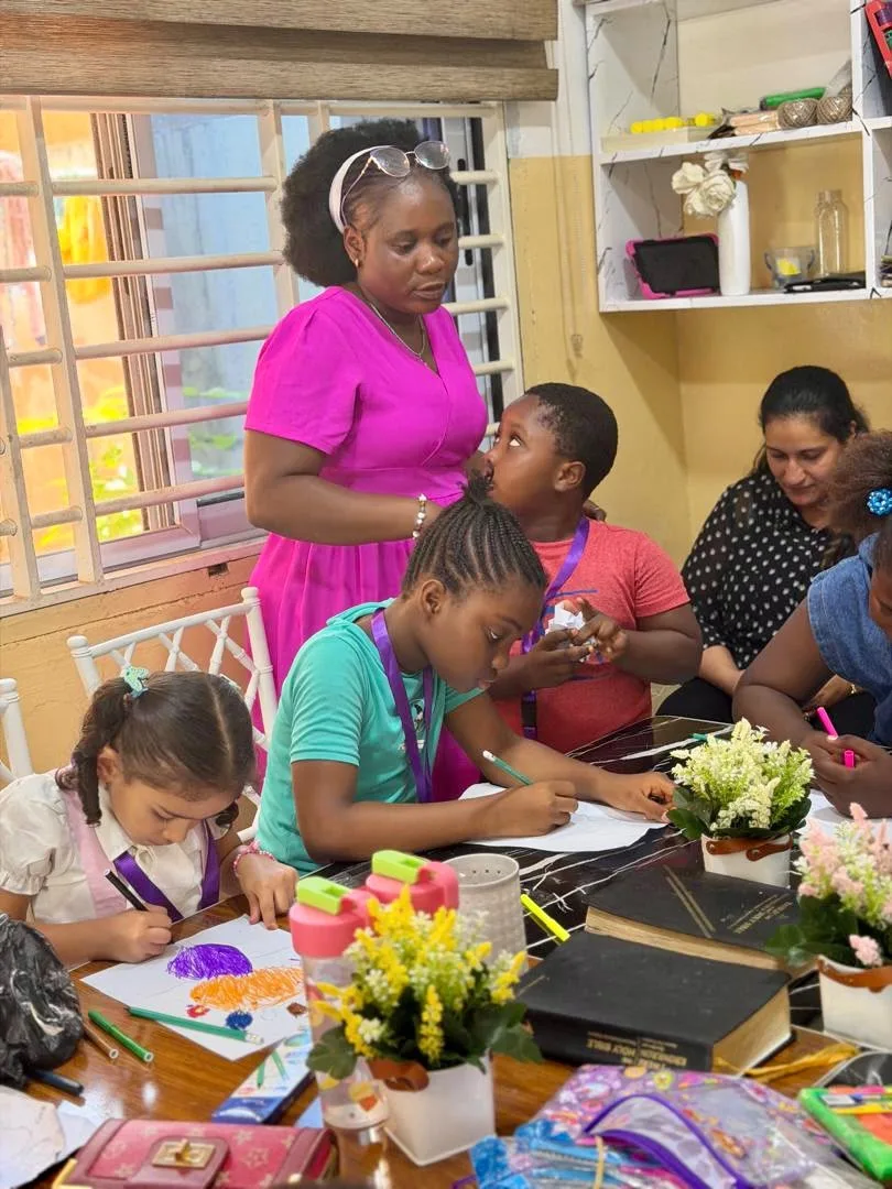 Parents helping a child with homework at home