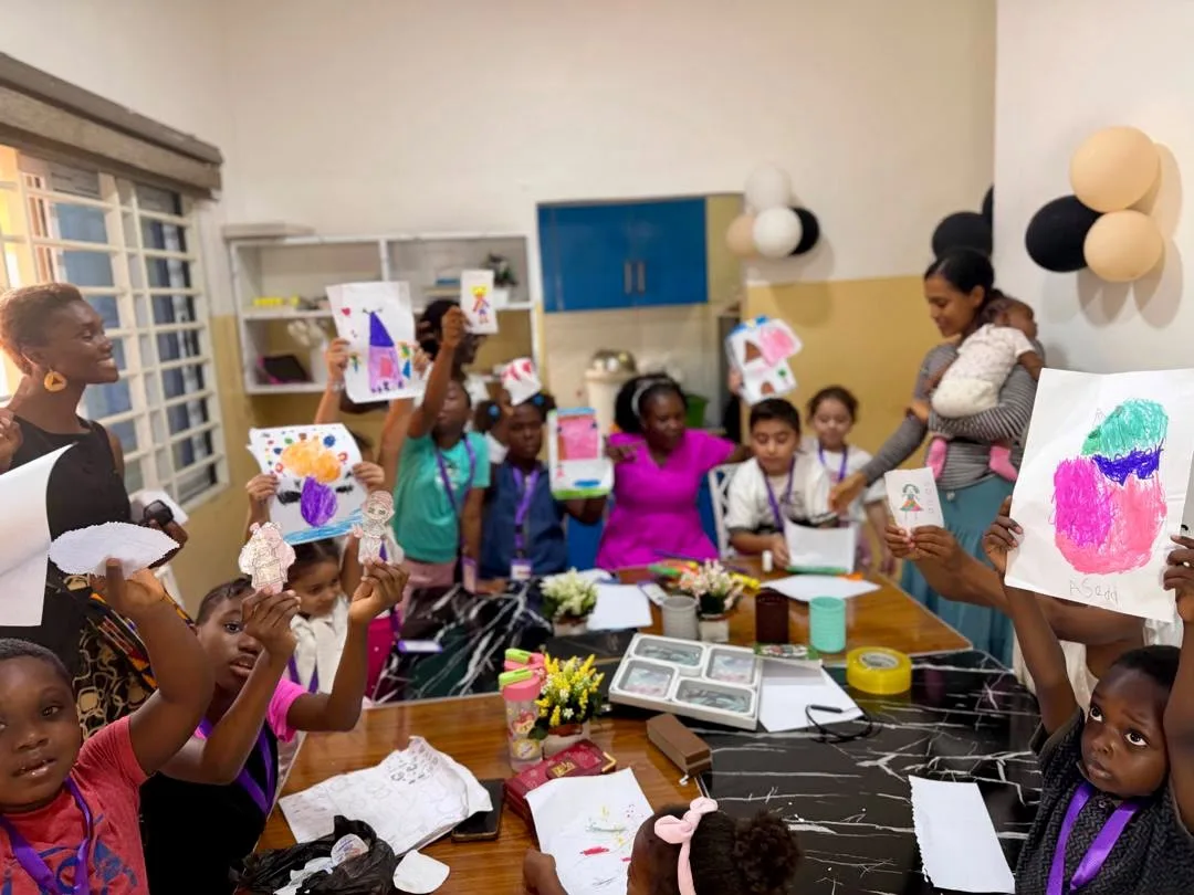 Teacher guiding children during a classroom activity