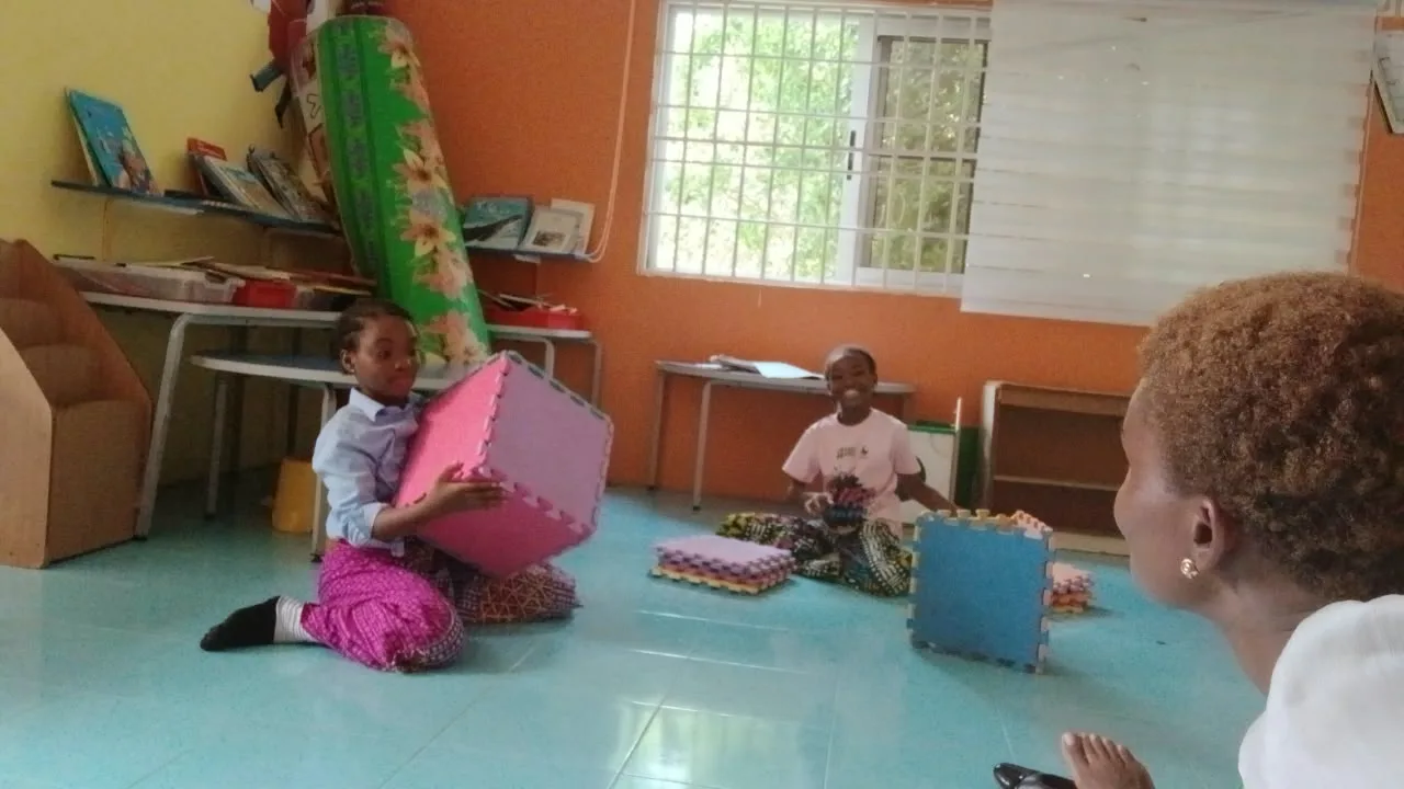 Teacher supporting children in a classroom